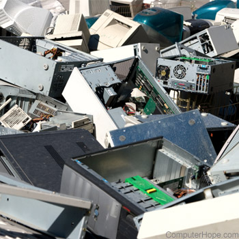 Pile of old computers, monitors, and printers.