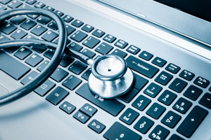 Stethoscope on a laptop keyboard.