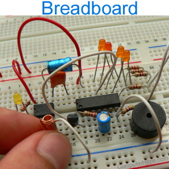 Breadboard with wires, capacitors, and integrated circuits