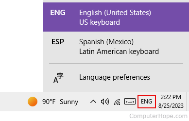 Changing the keyboard language in the notification area of Windows.